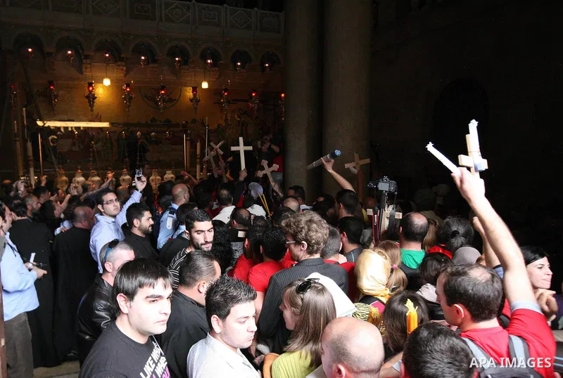 Christians Orthodox take part in Easter "Holy Fire" celebrations on the eve of Easter Sunday on April 23, 2011, at the Church of the Holy Sepulchre, built over the sites where Christians believe Christ was crucified and...
