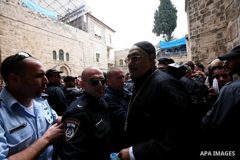 Christians Orthodox take part in Easter "Holy Fire" celebrations on the eve of Easter Sunday on April 23, 2011, outside the Church of the Holy Sepulchre, built over the sites where Christians believe Christ was crucified...