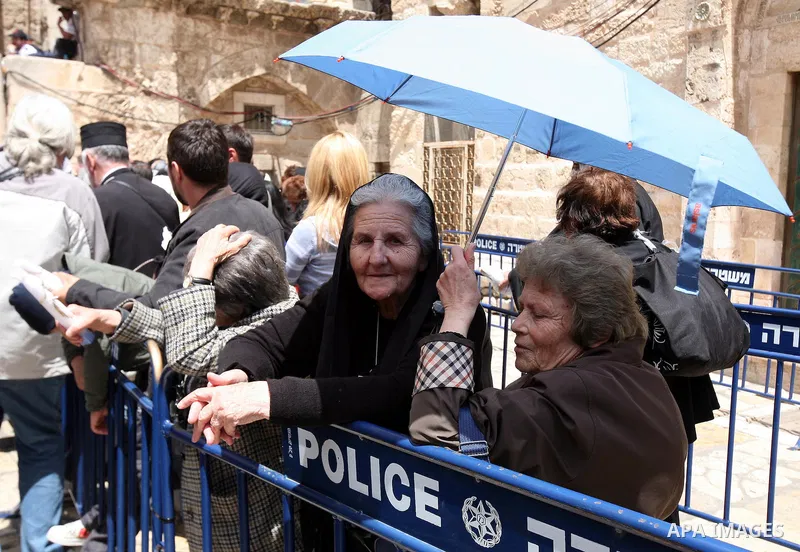 Israeli soldiers stand guard as Christians Orthodox take part in Easter "Holy Fire" celebrations on the eve of Easter Sunday on April 23, 2011, outside the Church of the Holy Sepulchre, built over the sites where Christi...