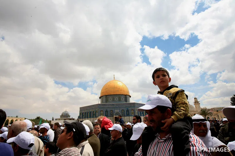 Palestinians take part in a celebration " The box of Al Aqsa child" in front of the Dome of the Rock on the compound known to Muslims as al-Haram al-Sharif, and to Jews as Temple Mount in Jerusalem's Old City on April 23...