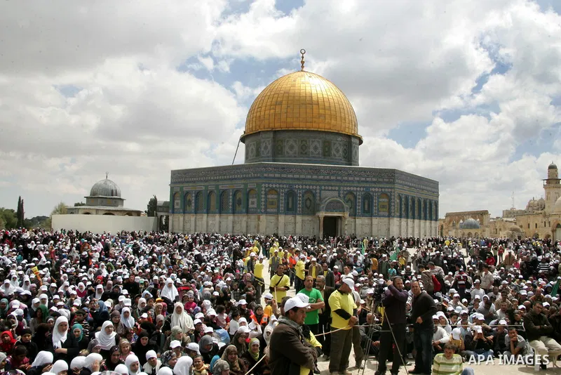 Palestinians take part in a celebration " The box of Al Aqsa child" in front of the Dome of the Rock on the compound known to Muslims as al-Haram al-Sharif, and to Jews as Temple Mount in Jerusalem's Old City on April 23...