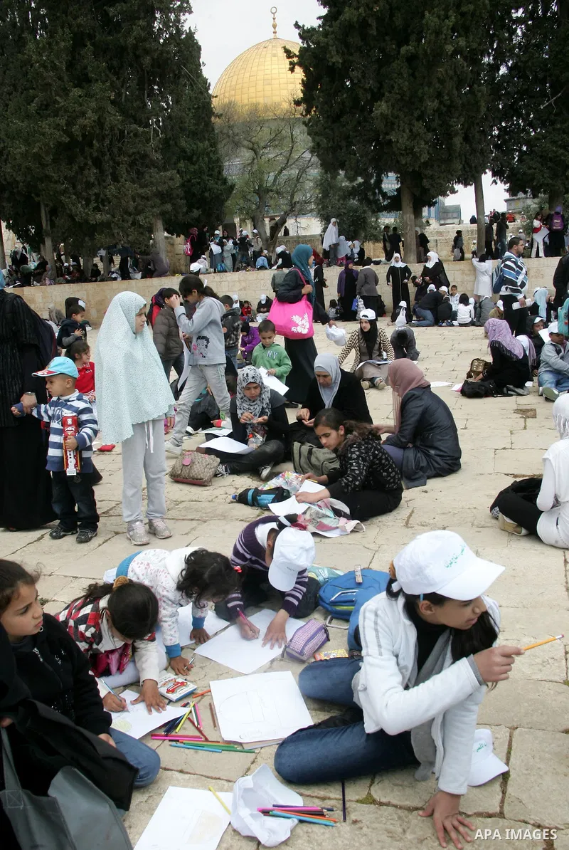 Palestinians take part in a celebration " The box of Al Aqsa child" in front of the Dome of the Rock on the compound known to Muslims as al-Haram al-Sharif, and to Jews as Temple Mount in Jerusalem's Old City on April 23...