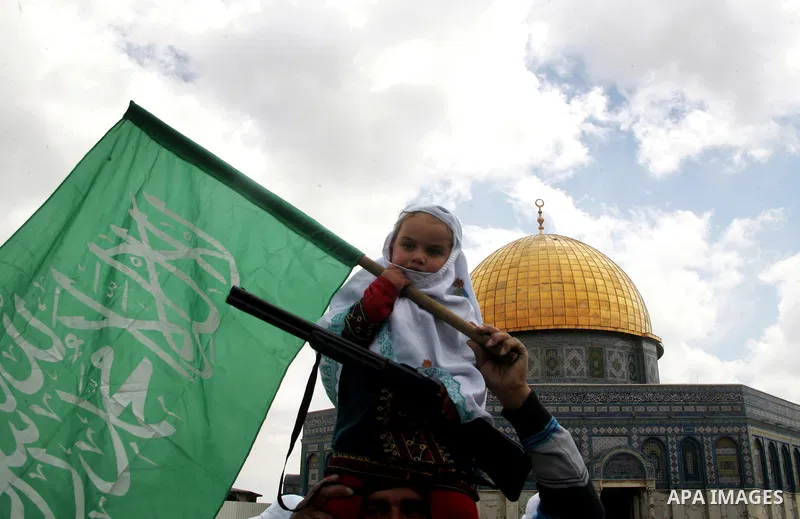 Palestinians take part in a celebration " The box of Al Aqsa child" in front of the Dome of the Rock on the compound known to Muslims as al-Haram al-Sharif, and to Jews as Temple Mount in Jerusalem's Old City on April 23...