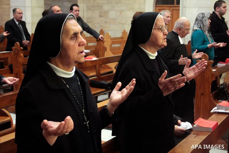 Roman Catholic nuns pray in the Sunday prayer in Saint Catherine in the complex of the Church of the Nativity in the biblical West Bank town of Bethlehem April 24 2011.Photo by Najeh Hashlamoun....