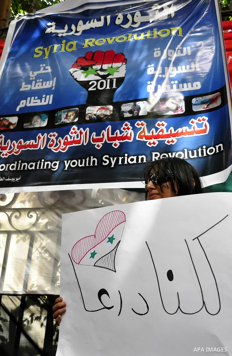 Syrians living in Egypt demonstrate against the recent actions of the Syrian government and in support of protesters, outside the Syrian Embassy on April 26, 2011. Syrian army units deployed in the city of Deraa which ha...