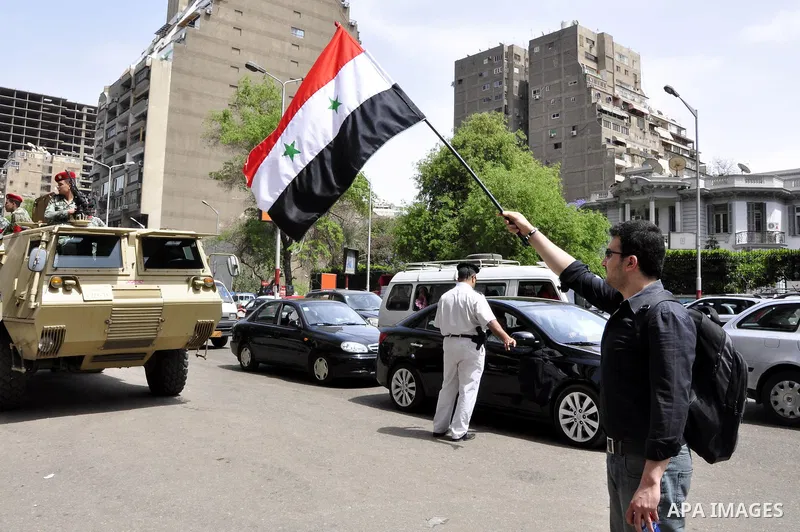 Syrians living in Egypt demonstrate against the recent actions of the Syrian government and in support of protesters, outside the Syrian Embassy on April 26, 2011. Syrian army units deployed in the city of Deraa which ha...