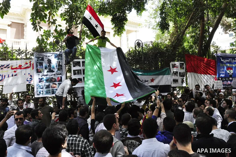 Syrians living in Egypt demonstrate against the recent actions of the Syrian government and in support of protesters, outside the Syrian Embassy on April 26, 2011. Syrian army units deployed in the city of Deraa which ha...