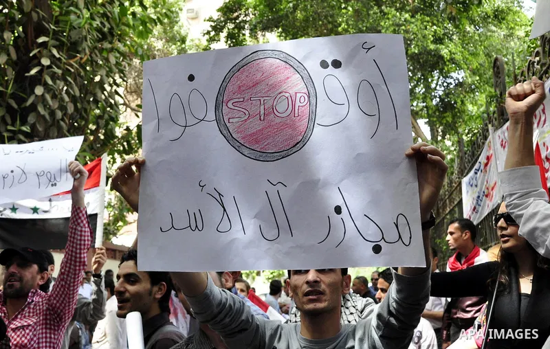 Syrians living in Egypt demonstrate against the recent actions of the Syrian government and in support of protesters, outside the Syrian Embassy on April 26, 2011. Syrian army units deployed in the city of Deraa which ha...