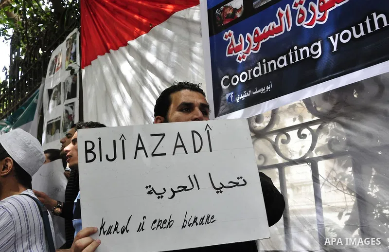Syrians living in Egypt demonstrate against the recent actions of the Syrian government and in support of protesters, outside the Syrian Embassy on April 26, 2011. Syrian army units deployed in the city of Deraa which ha...