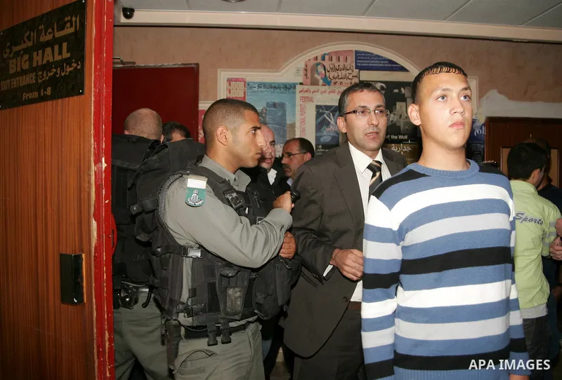 Israeli border officers scuffle with Palestinians at the Palestinian National Theatre in East Jerusalem on April 26,2011. Photo by Mahfouz Abu Turk