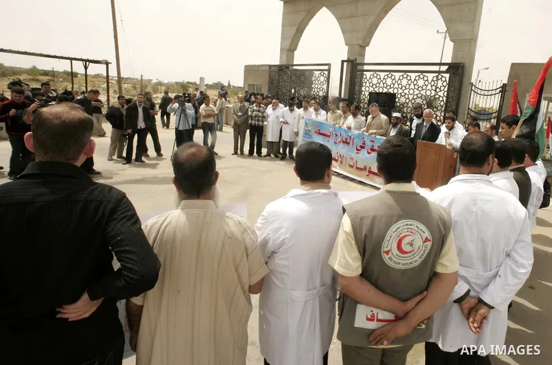 Palestinian doctors protest in front of the Rafah crossing border between Egypt and Gaza Strip on April ,27,2011, calling the new Egyptian government to open the crossing border for entering the medical needs. Photo by A...