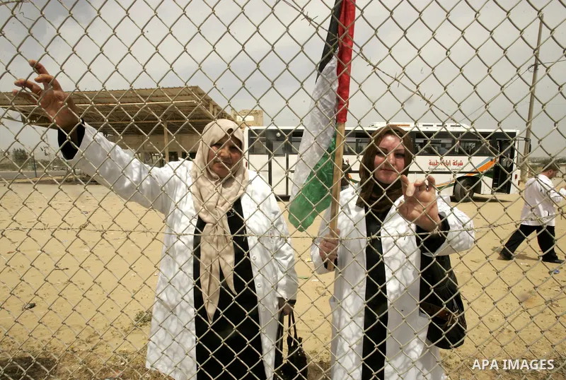 Palestinian doctors protest in front of the Rafah crossing border between Egypt and Gaza Strip on April ,27,2011, calling the new Egyptian government to open the crossing border for entering the medical needs. Photo by A...
