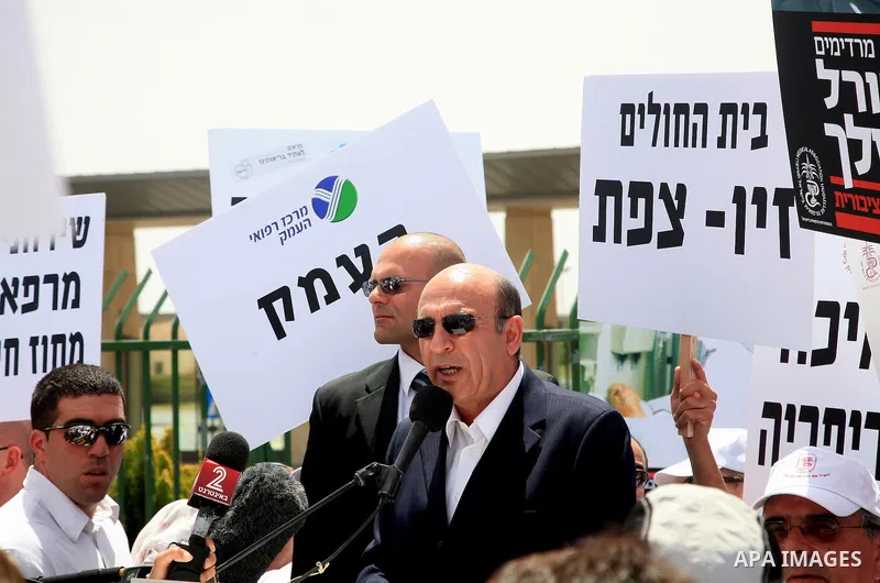 Israeli MK Shaul Mofaz takes part in a protest held by doctors and medical students from all over Israel, outside the Knesset in Jerusalem on April 27,2011 against the poor terms of their employment. Due to their strike...