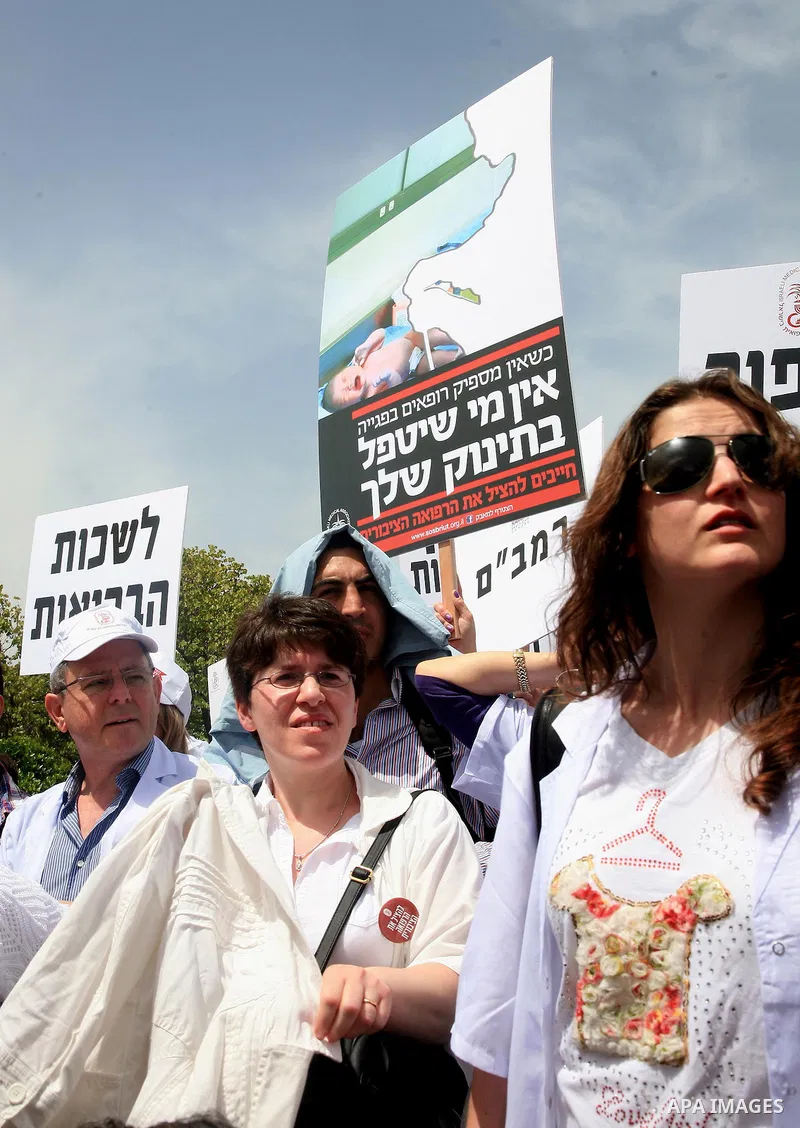 Doctors and medical students from all over Israel protest outside the Knesset in Jerusalem on April 27,2011 against the poor terms of their employment. Due to their strike surgeries that are not urgent will not be perfor...