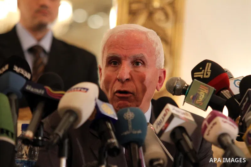 Palestinian Fatah delegation chief Azzam al-Ahmed speaks during a joint press conference with Hamas deputy leader Mussa Abu Marzuq and senior Hamas member Mahmud Zahar in Cairo on April 27, 2011 as the rival Palestinian...