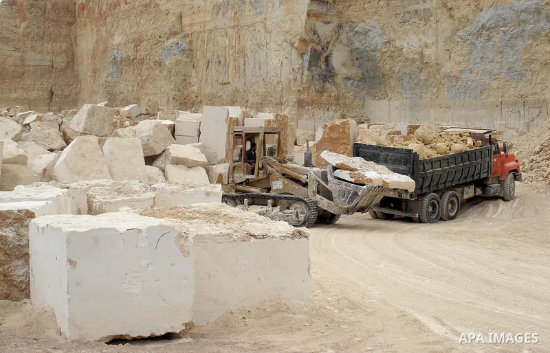 Palestinian labourers work at a quarry in the West Bank village of Taffouh near Hebron April 28, 2011. Stone and marble factories and quarries, located mainly in the West Bank cities of Bethlehem and Hebron, are at the c...