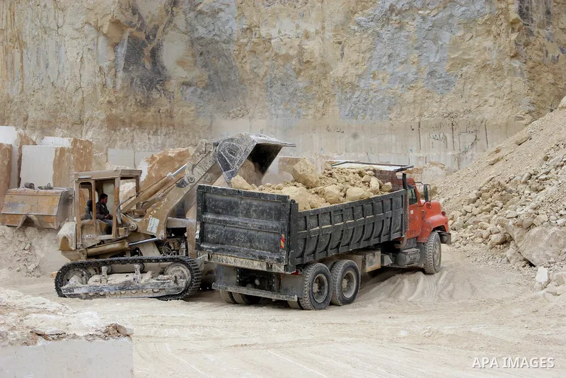 Palestinian labourers work at a quarry in the West Bank village of Taffouh near Hebron April 28, 2011. Stone and marble factories and quarries, located mainly in the West Bank cities of Bethlehem and Hebron, are at the c...