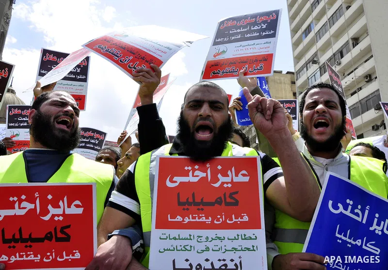 Salafists hold banners calling for the release of Kamilia Shehata, a Muslim woman who according to them is kept by the Coptic Church, during a protest in front of Al Nour mosque in Abbasiya, Cairo, Egypt, 29 April 2011....