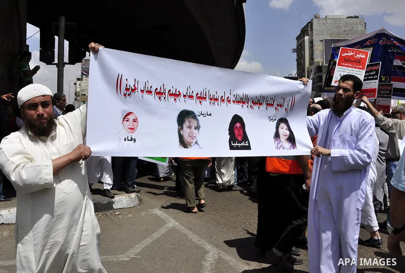 Salafists hold banners calling for the release of Kamilia Shehata, a Muslim woman who according to them is kept by the Coptic Church, during a protest in front of Al Nour mosque in Abbasiya, Cairo, Egypt, 29 April 2011....