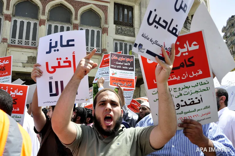 Salafists hold banners calling for the release of Kamilia Shehata, a Muslim woman who according to them is kept by the Coptic Church, during a protest in front of Al Nour mosque in Abbasiya, Cairo, Egypt, 29 April 2011....
