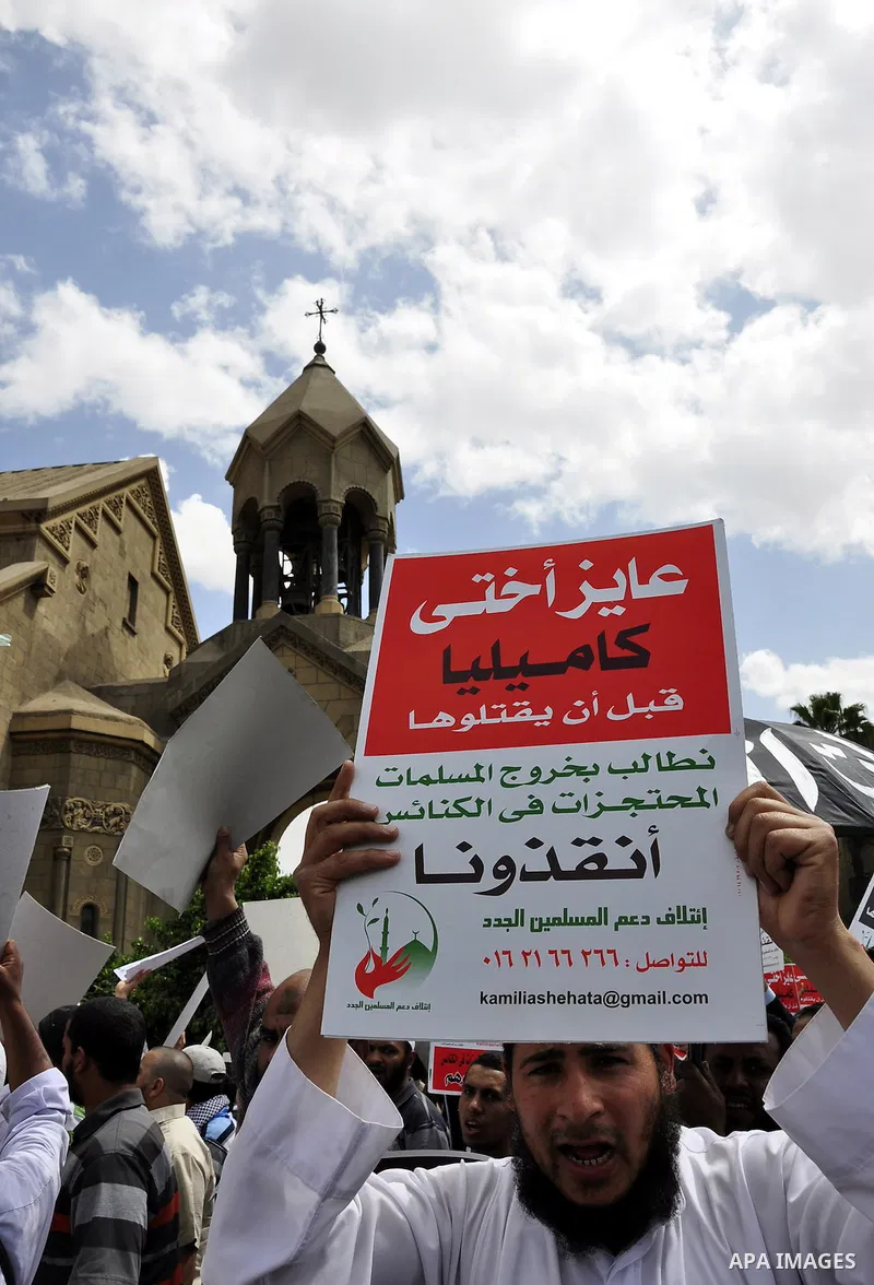 Salafists hold banners calling for the release of Kamilia Shehata, a Muslim woman who according to them is kept by the Coptic Church, during a protest in front of Al Nour mosque in Abbasiya, Cairo, Egypt, 29 April 2011....