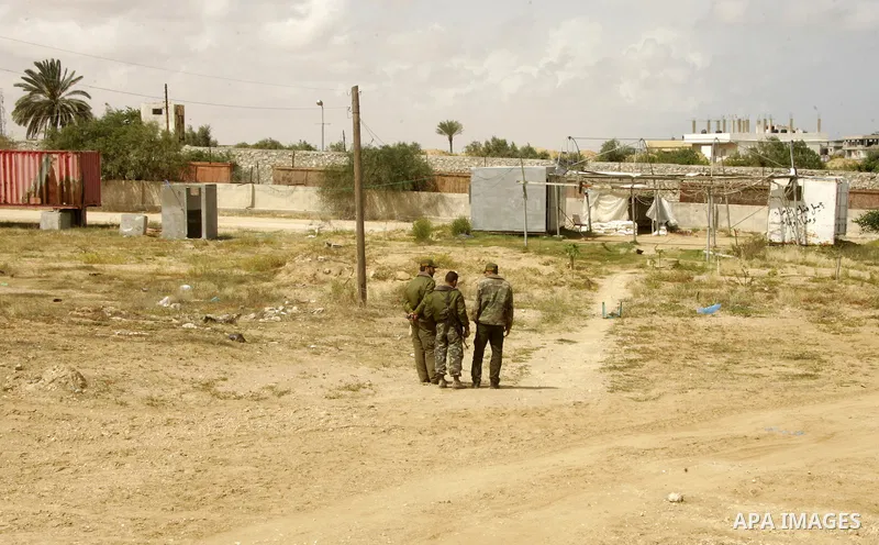 Palestinian Hamas security forces walk near Rafah close to the border between Egypt and the southern Gaza Strip on April 30, 2011, a day after Egypt said it will permanently open the Rafah border crossing as part of its...