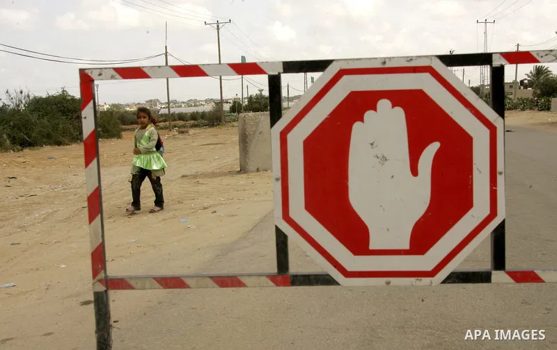Palestinian Hamas security forces chat with a driver at the Rafah border crossing between Egypt and the southern Gaza Strip town of Rafah on April 30, 2011, a day after Egypt said it will permanently open the Rafah borde...
