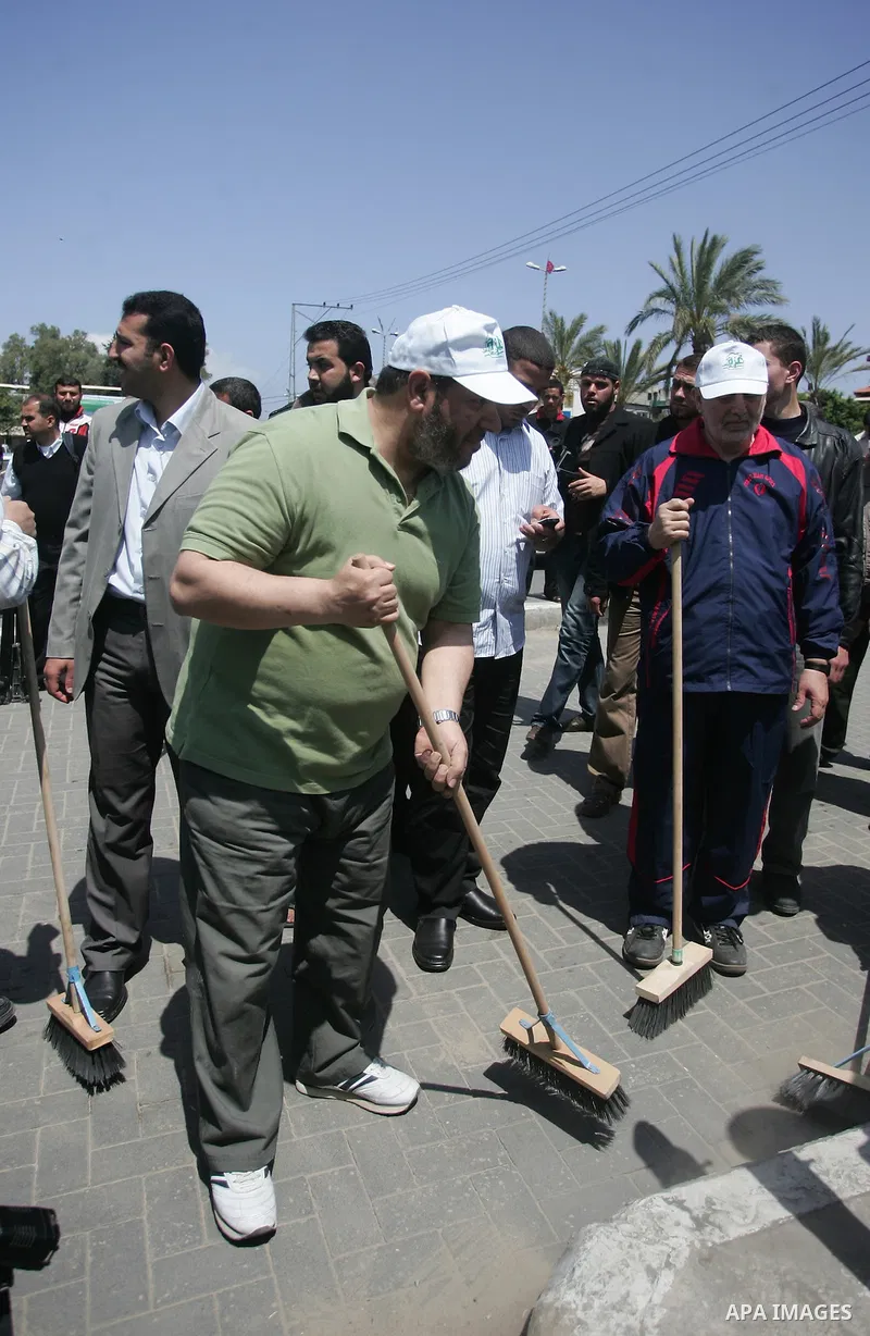 Palestinian Hamas leader, Khaleel Al-Hayia Participate in cleaning streets and planting olive trees during a campaign organized by Hamas in Gaza City on May 1, 2011. Photo by Mohammed Othman