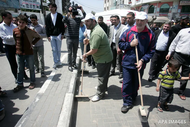 Palestinian Hamas leader, Khaleel Al-Hayia Participate in cleaning streets and planting olive trees during a campaign organized by Hamas in Gaza City on May 1, 2011. Photo by Mohammed Othman