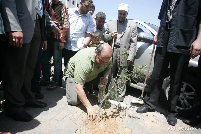 Palestinian Hamas leader, Khaleel Al-Hayia Participate in cleaning streets and planting olive trees during a campaign organized by Hamas in Gaza City on May 1, 2011. Photo by Mohammed Othman