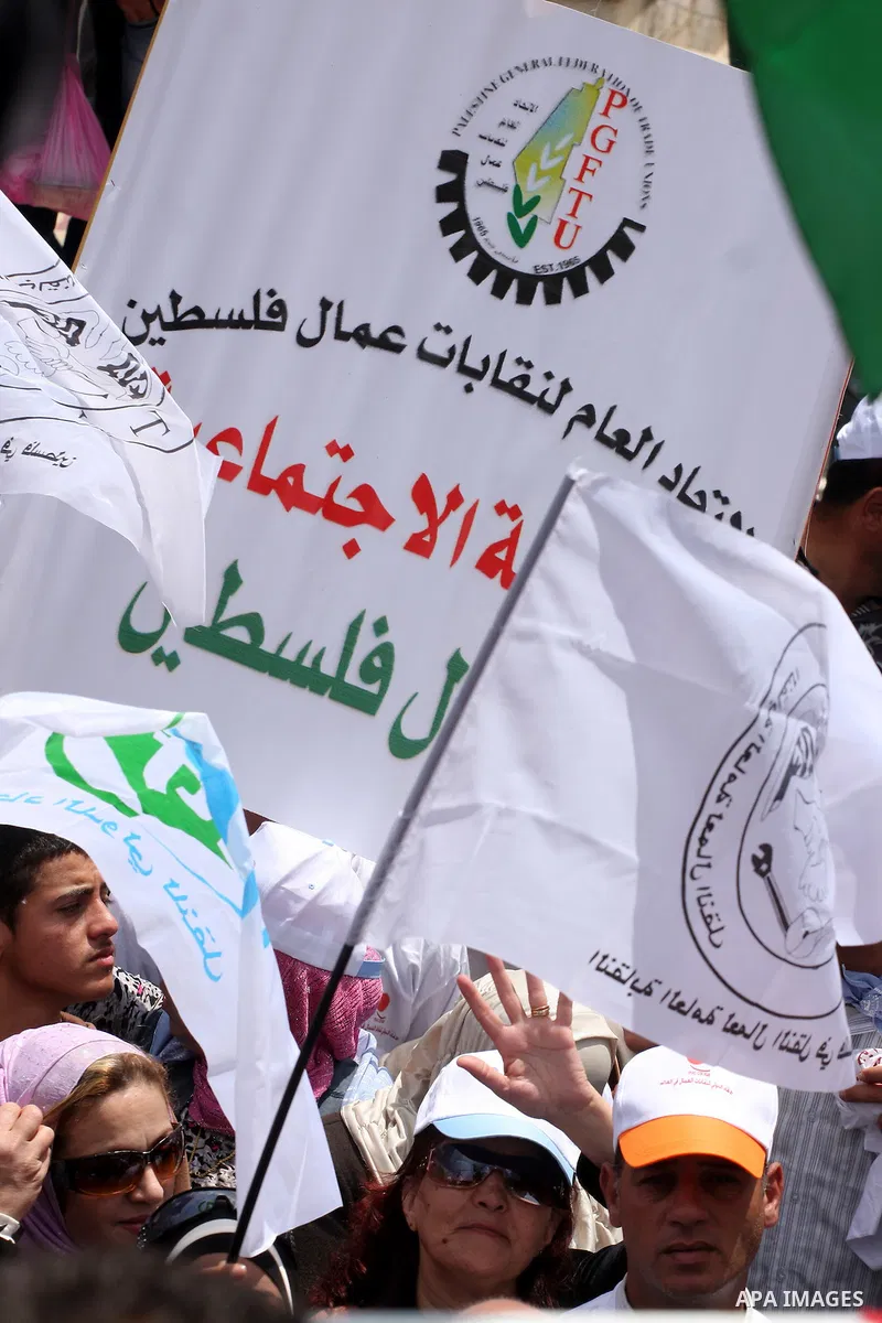 Palestinians hold a rally in the city of Ramallah in the Israeli occupied West Bank during May Day celebrations demanding jobs, freedom of movement between towns and cities currently restricted by Israeli army checkpoint...