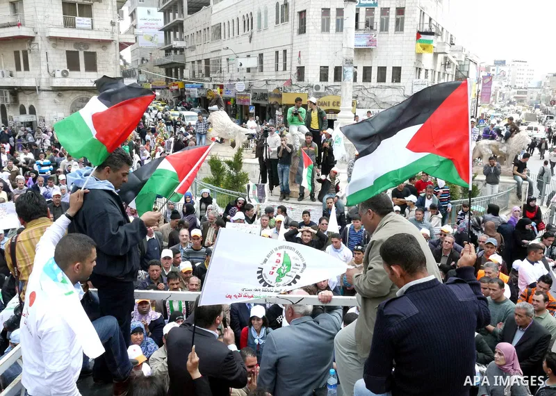 Palestinians hold a rally in the city of Ramallah in the Israeli occupied West Bank during May Day celebrations demanding jobs, freedom of movement between towns and cities currently restricted by Israeli army checkpoint...