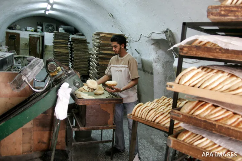 A labour works at bakery as Palestinians marking workers' May Day in Jerusalem's old city on May 01, 2011.Photo by Mahfouz Abu Turk