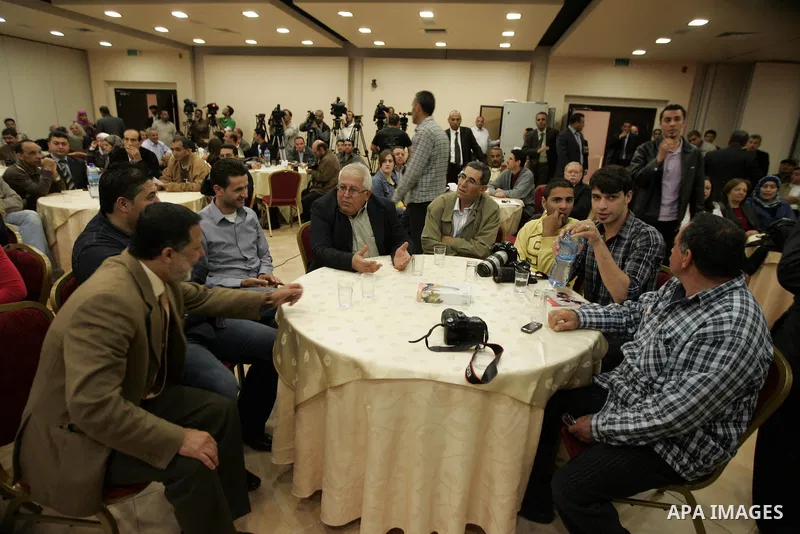 Palestinians attend a celebration to honor the photojournalists who won in the contest of "Palestine for Photography" at the Red Crescent hall in the West Bank city of Ramallah on May 2,2011. Photo by Issam Rimawi