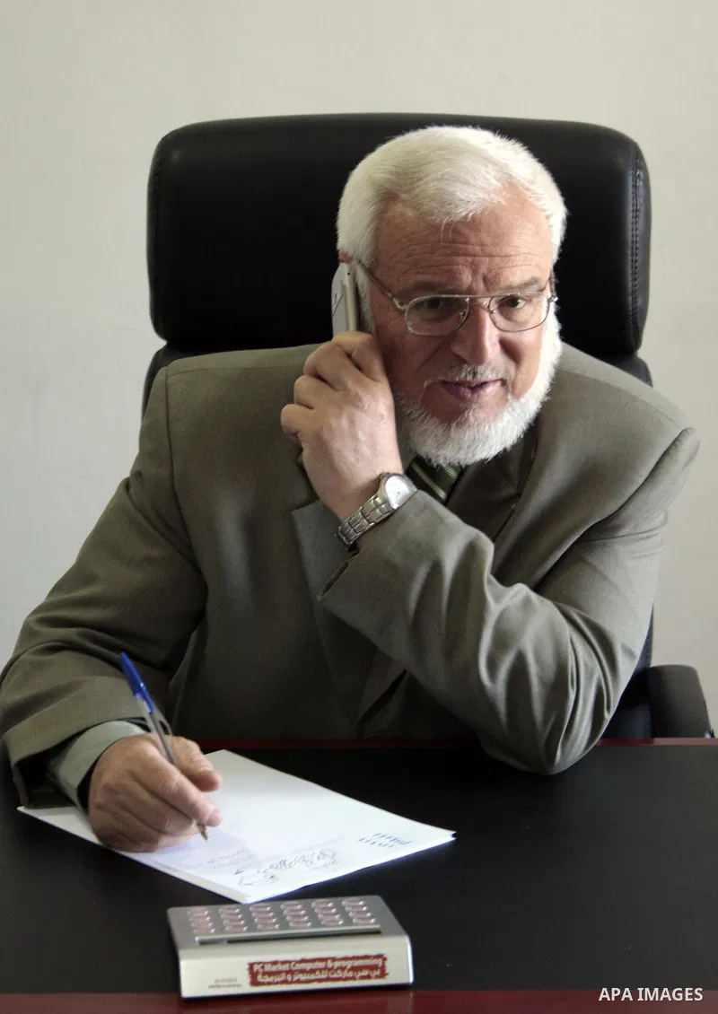 Palestinian parliament spokesman, Aziz Dweik meets with Hamas members of the Palestinian Legislative Council (PLC) at his office in the West Bank city of Hebron on May 03, 2011, a day before Palestinian factions sign a r...