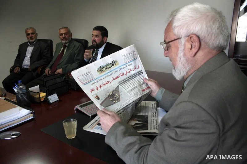 Palestinian parliament spokesman, Aziz Dweik meets with Hamas members of the Palestinian Legislative Council (PLC) at his office in the West Bank city of Hebron on May 03, 2011, a day before Palestinian factions sign a r...