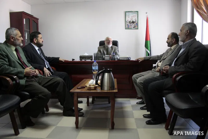Palestinian parliament spokesman, Aziz Dweik meets with Hamas members of the Palestinian Legislative Council (PLC) at his office in the West Bank city of Hebron on May 03, 2011, a day before Palestinian factions sign a r...