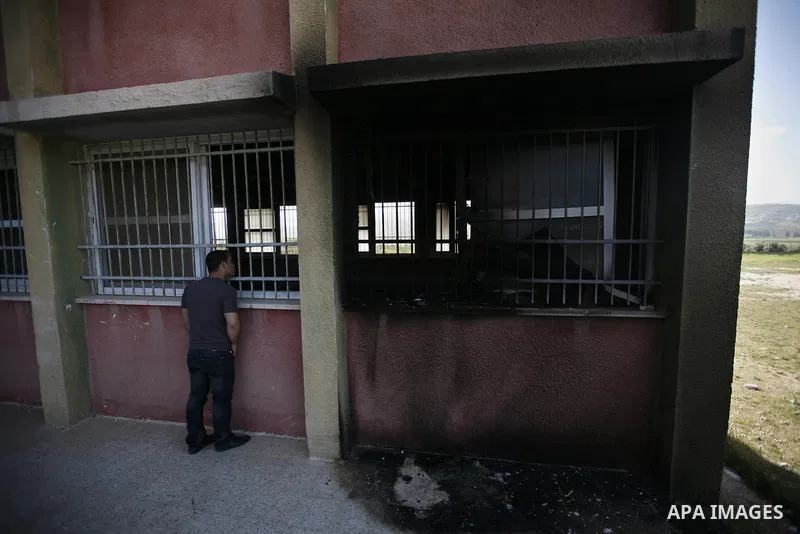 A Palestinian inspects a mosque, situated inside a school, which was allegedly burnt by Israeli settlers in the West Bank village of Hawara, south of Nablus, on May 03, 2011 as Israeli police arrested a group of Israeli...