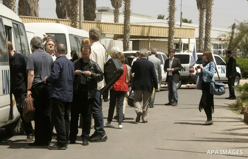 The team of Israeli conductor Daniel Barenboim arrives to the Gaza Strip at the Rafah border terminal between Egypt and the Palestinian coastal strip on May 03, 2011 before his "peace concert" which marks the first time...