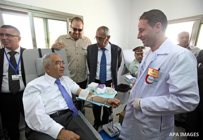 Palestinian Prime Minister, Salam Fayyad donates blood for cancer patients in the West Bank city of Ramallah on May 3, 2011. Photo by Mustafa Abu Dayeh