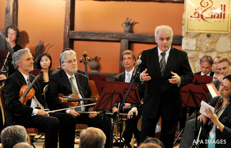 Israeli Maestro Daniel Barenboim, UN Messenger of Peace, conducts the Orchestra for Gaza, a mixed orchestra of European musicians, during concert at the Al Mathaf Cultural House in Gaza City, Tuesday, May, 3, 2011. Baren...