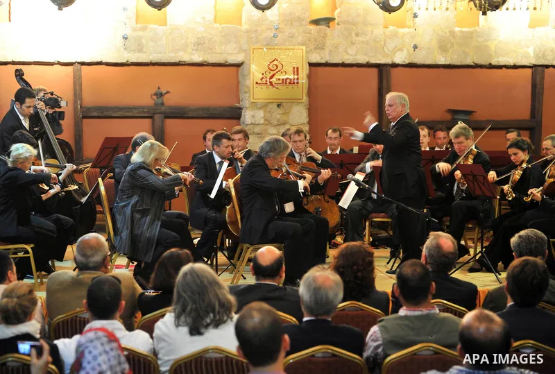 Israeli Maestro Daniel Barenboim, UN Messenger of Peace, conducts the Orchestra for Gaza, a mixed orchestra of European musicians, during concert at the Al Mathaf Cultural House in Gaza City, Tuesday, May, 3, 2011. Baren...