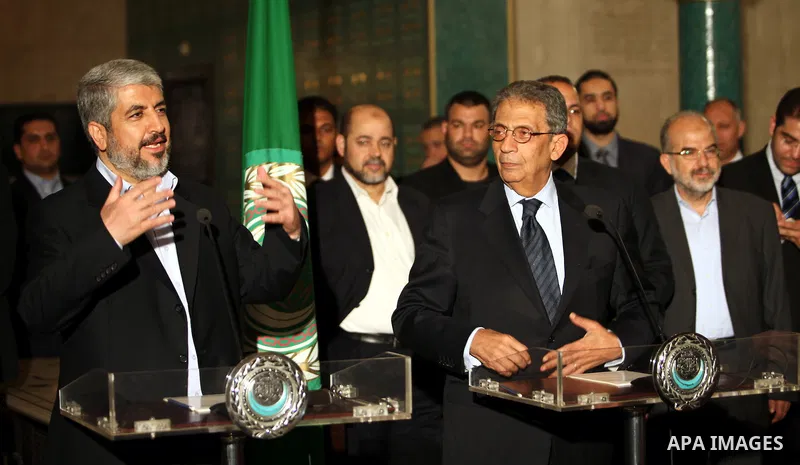 Arab League General Secretary Amr Mussa meets with Senior Hamas Leader Khaled Mashaal and senior Hamas members in Cairo on May 3, 2011. Palestinian factions signed a reconciliation deal in Cairo to end the divide between...