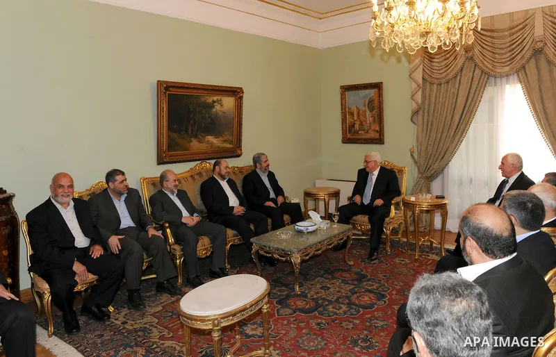 Palestinian President Mahmoud Abbas (Abu Mazen) meets with Hamas delegation headed by Senior Hamas leader Khaled Mashaal in Cairo, Egypt on May 4,2011. Fatah and Hamas officials lead a ceremony celebrating the signing of...