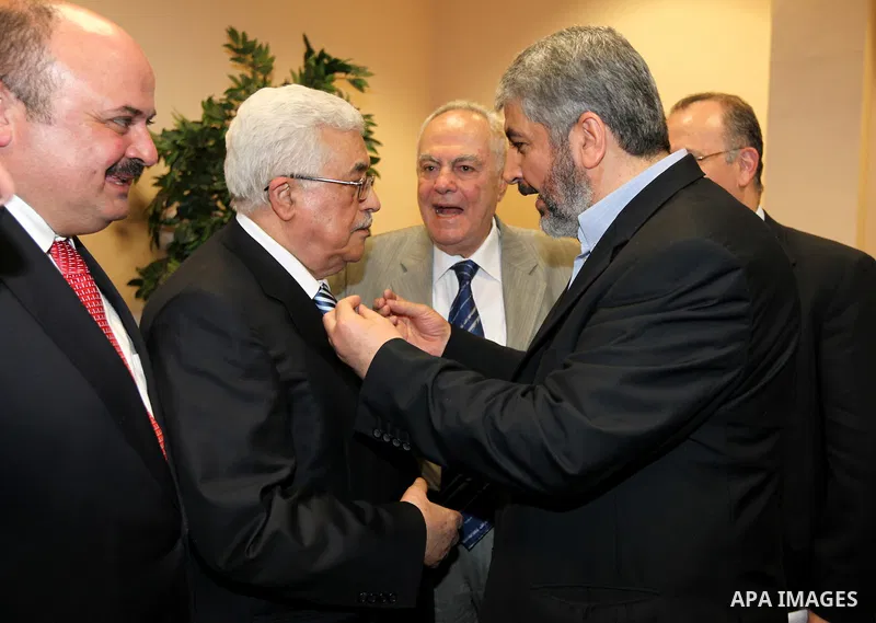 Palestinian President Mahmoud Abbas (Abu Mazen) meets with Senior Hamas leader Khaled Mashaal in Cairo, Egypt on May 4,2011. Fatah and Hamas officials lead a ceremony celebrating the signing of a reconciliation deal inte...