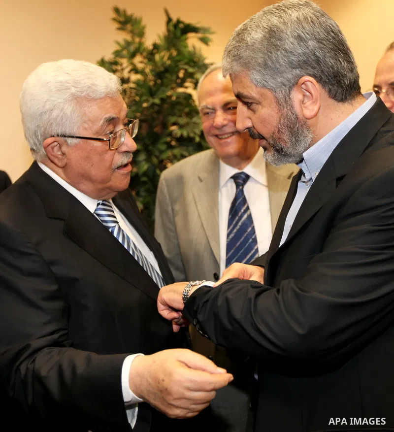 Palestinian President Mahmoud Abbas (Abu Mazen) meets with Senior Hamas leader Khaled Mashaal in Cairo, Egypt on May 4,2011. Fatah and Hamas officials lead a ceremony celebrating the signing of a reconciliation deal inte...