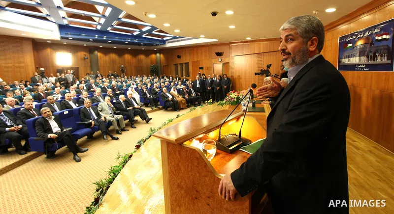 Senior Hamas leader Khaled Mashaal attends the signing of reconciliation agreement in Cairo, Egypt on May 4,2011. Fatah and Hamas officials lead a ceremony celebrating the signing of a reconciliation deal intended to rep...
