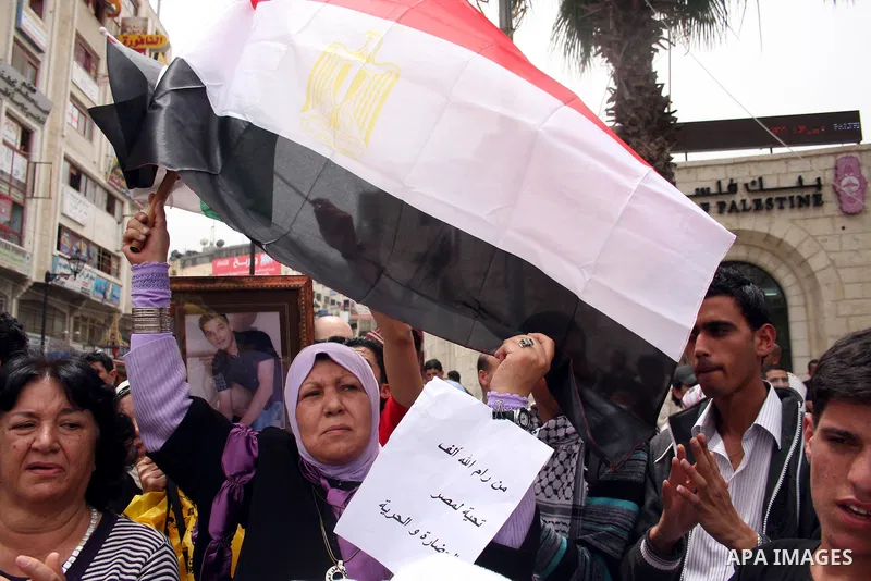 Palestinians celebrate during a rally in the West Bank city of Ramallah on May 04, 2011 as Palestinians in the West Bank and Gaza Strip gather to welcome a reconciliation deal signed by rival movements Hamas and Fatah in...