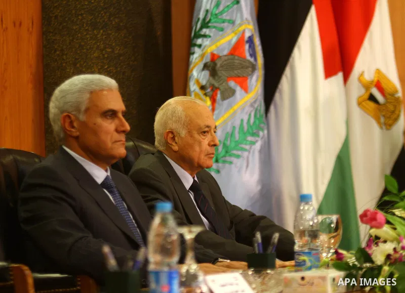 Egyptian intelligence chief General Murad Muafi and Egyptian Foreign Minister Nabil al-Arabi attend a reconciliation ceremony between the Fatah party and the Hamas movement in the Egyptian capital Cairo on May 4, 2011. F...