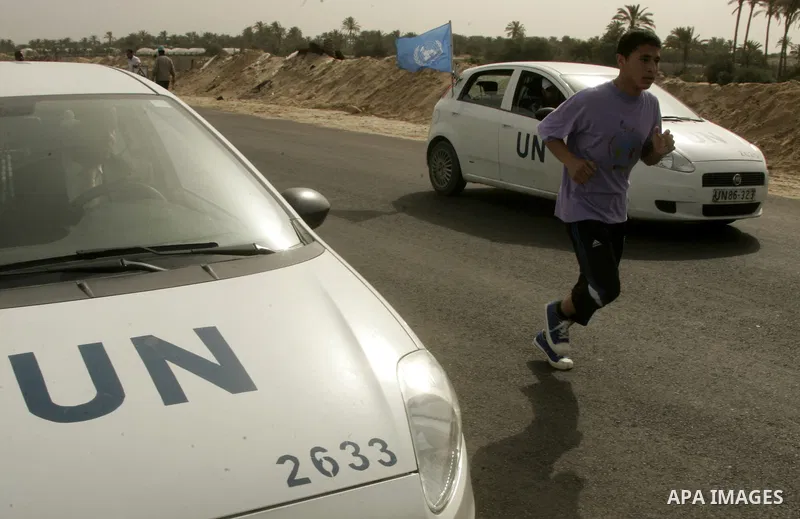 A Palestinian participant runs in Rafah town in the southern Gaza Strip on May 5, 2011 as they compete in the Gaza Strip's first-ever marathon which runs the entire length of the coastal enclave. Photo by Abed Rahim Khat...